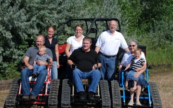 Group of people in off-road wheelchairs