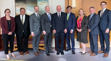 A picture of Governor Walz, Commissioner Varilek, Minnesota Department of Agriculture Commissioner Thom Petersen and Deputy Commissioner McKinnon standing with the delegation partners.
