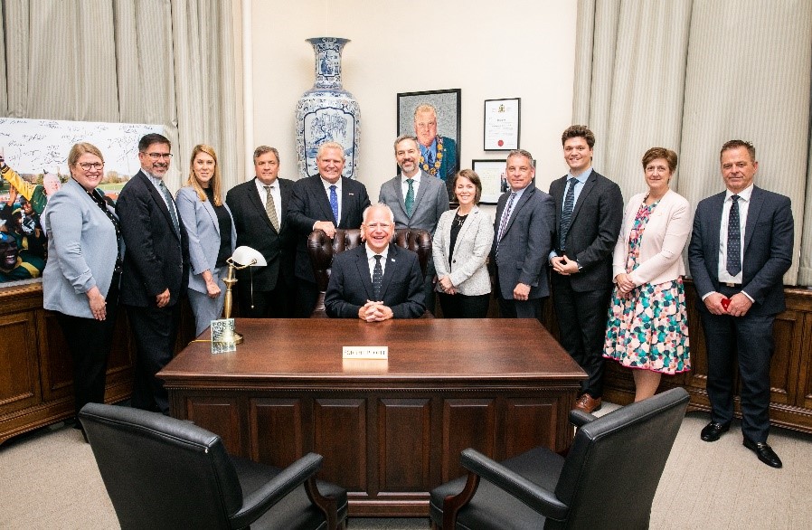 Group photo including Governor Walz, Commissioner Varilek, Deputy Commissioner Kevin McKinnon and Commissioner Petersen with Ontario Premier Ford and others.