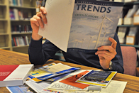 Person reading Trends magazine