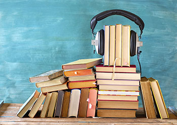 headphones on a stack of books